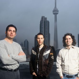 A photo of Spin Master's co-founders: Anton Rabie (left), Ronnen Harary (right), and Ben Varadi (middle)